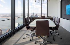 A soft boat-shaped HALO table and matching credenza elevates the clean lines of this meeting space. thumbnail